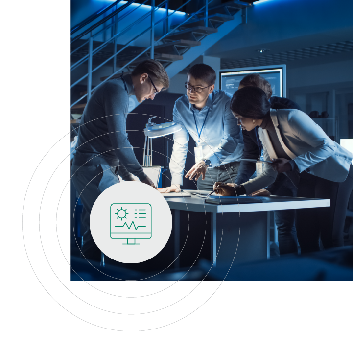 A group of diverse individuals in business casual attire, gathered around a table, engaged in reviewing data on screens and documents.
