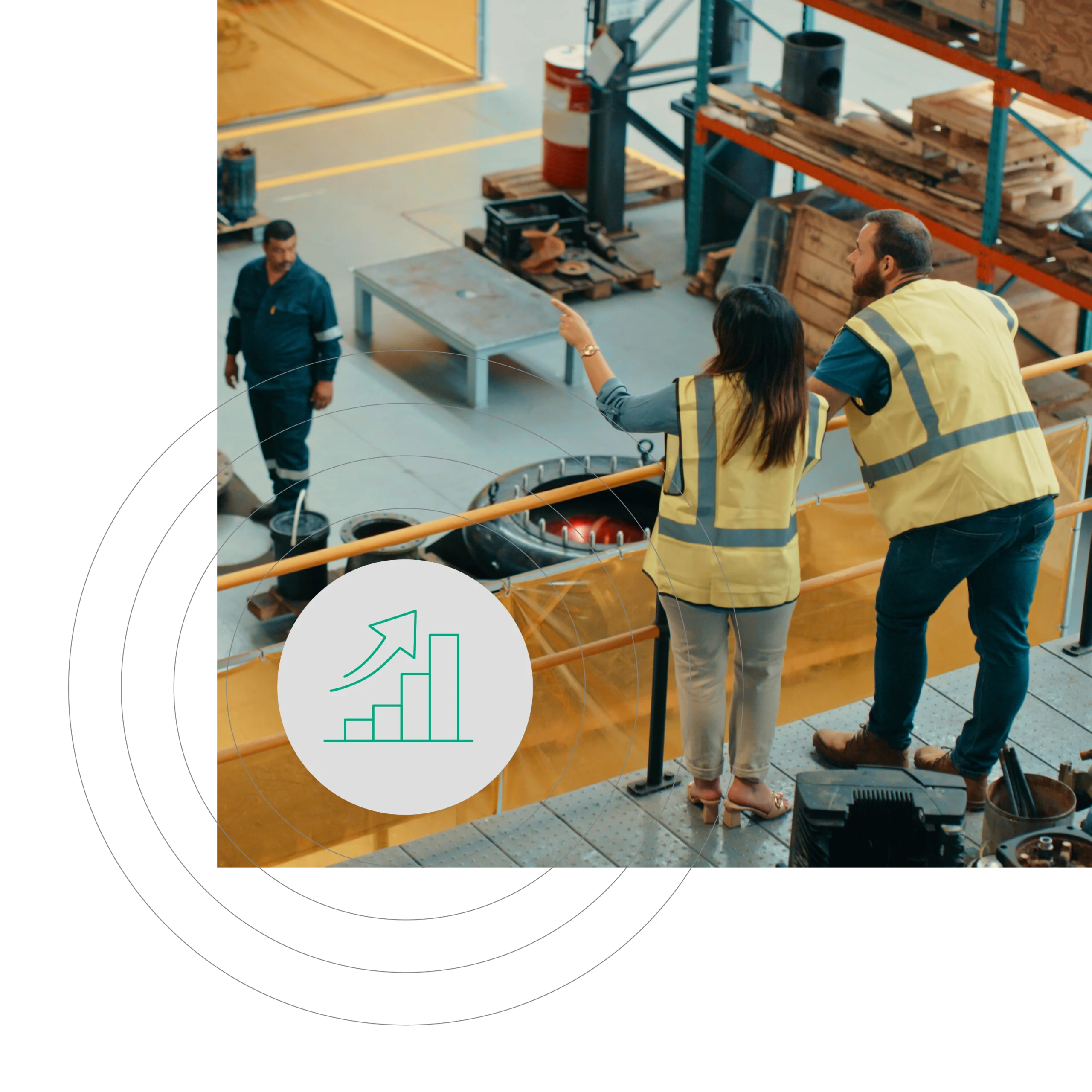 High-angle shot of workers in yellow vests on a raised platform, pointing towards machinery. Background includes industrial equipment and shelving units with a bar graph overlay.