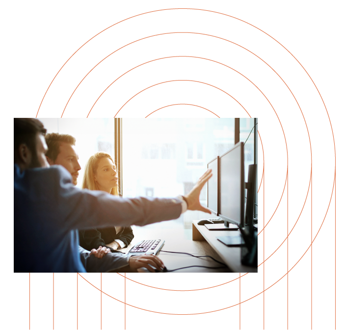 image of two people looking at a computer screen