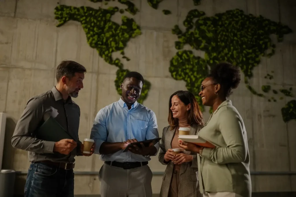 group of coworkers viewing a tablet